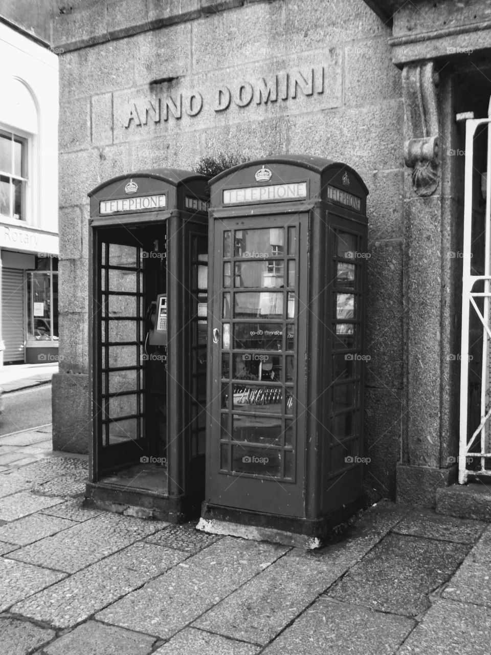Penzance Cornwall UK type 2 phone boxes wooden and cast iron doors one missing