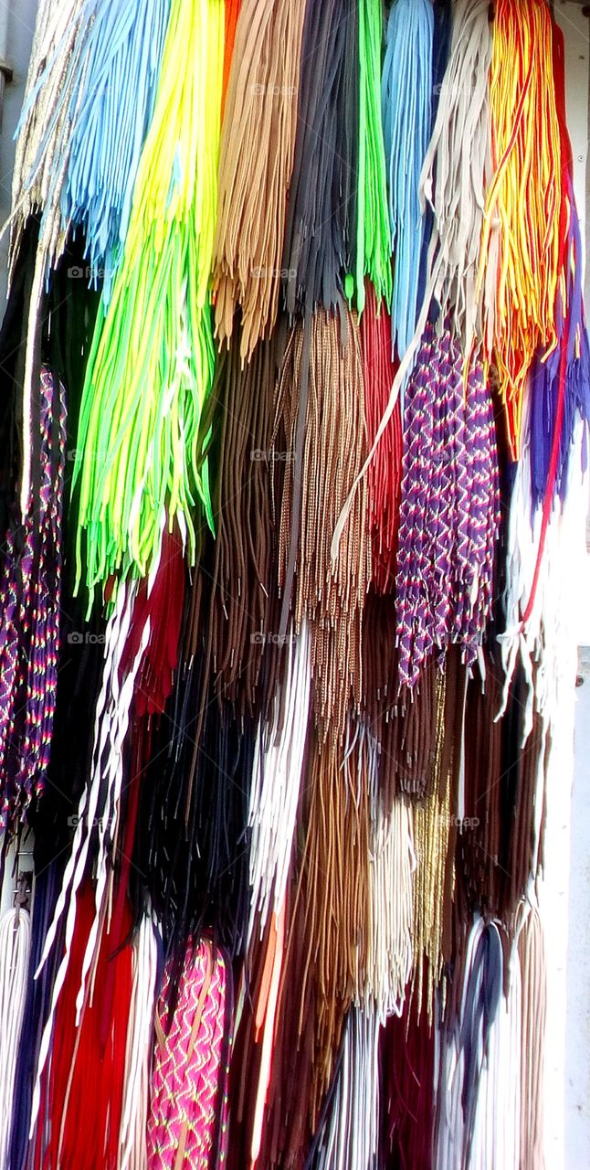 Shoeslaces hanging outdoors