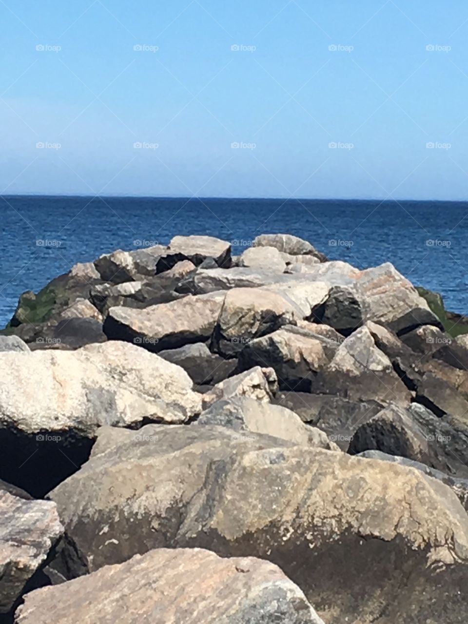 Fishing rocks at beach.