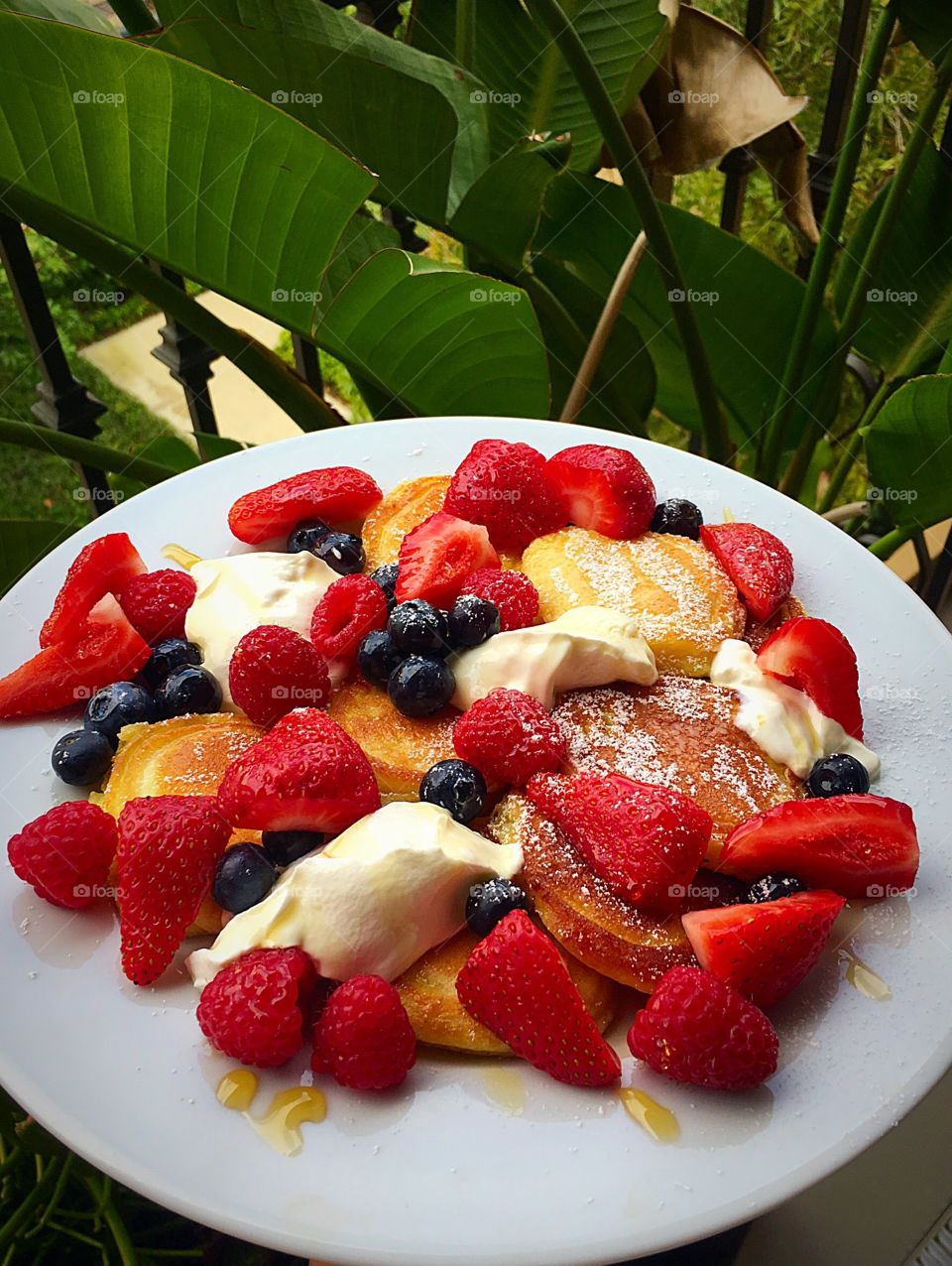 Pancakes with strawberries on the balcony 