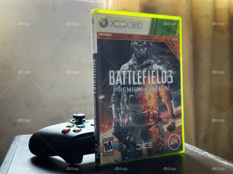 Battlefield video game box in front of a Xbox controller with natural light at the background.