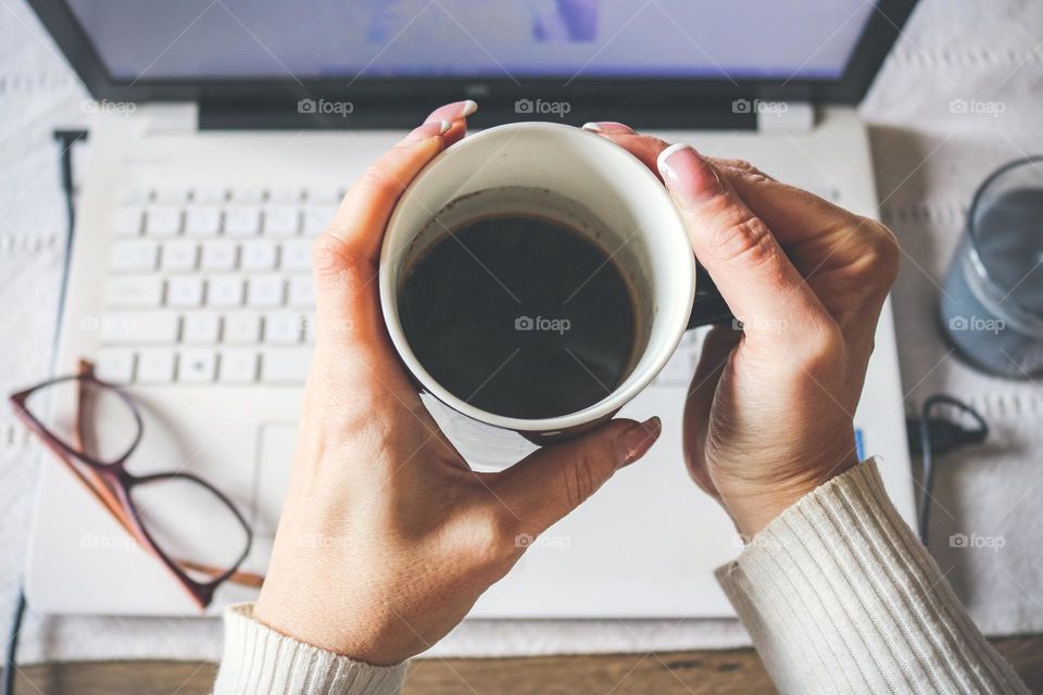 Woman holding coffee