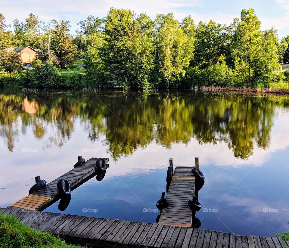 Tranquil lake front with boat docks