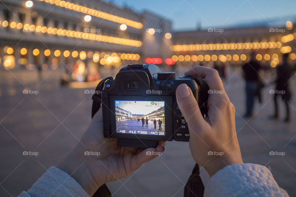 Photographing in famous Saint Marcus square in Venice, Italy