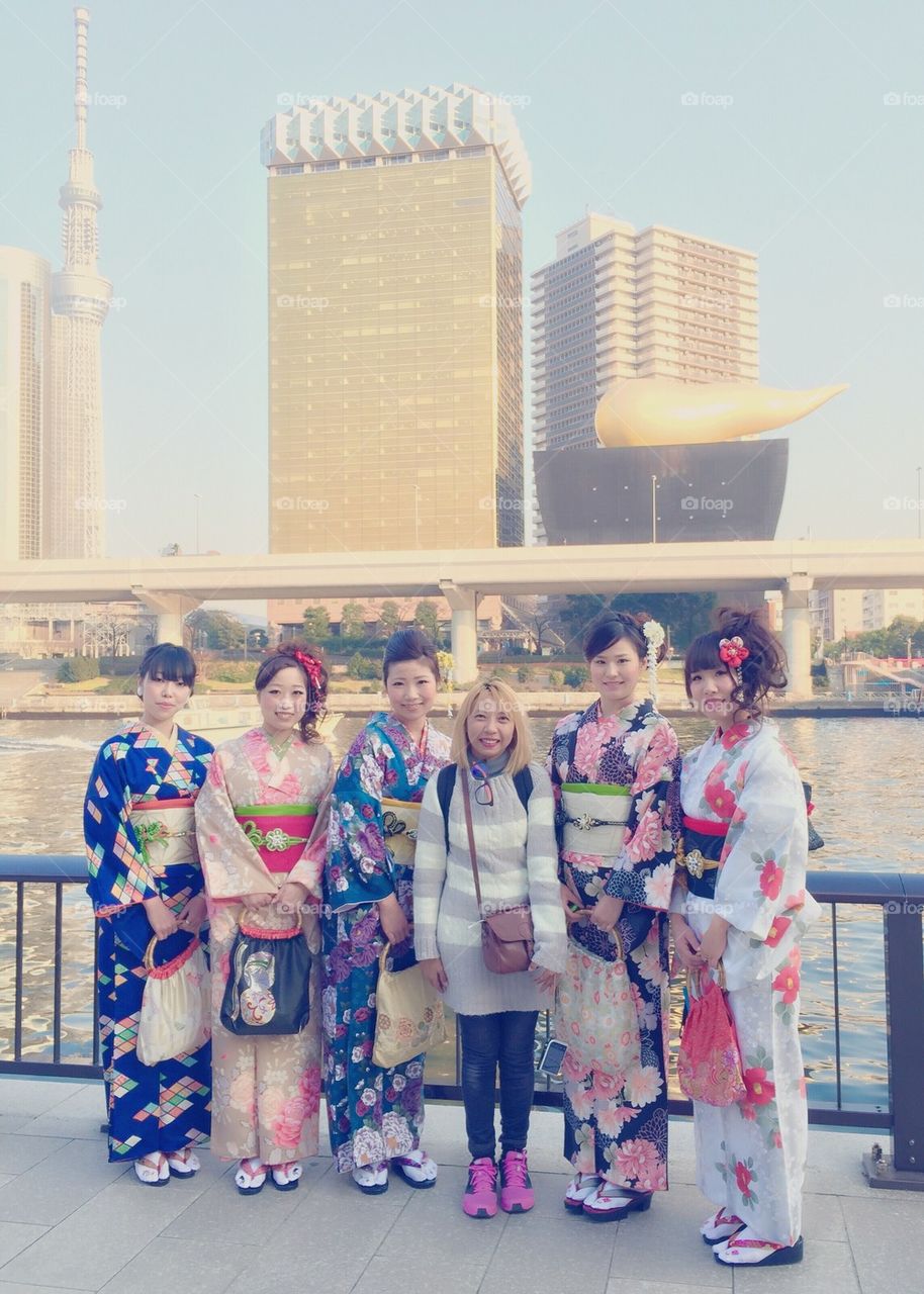 With Japanese pretty girls in kimono dress.