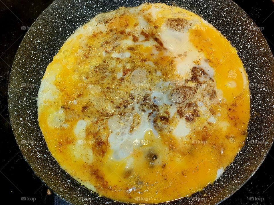 Fried egg with cheese.