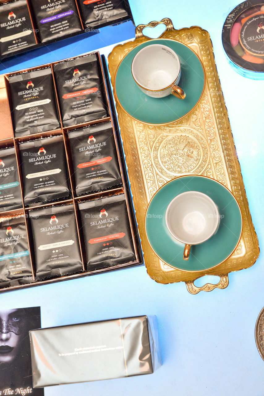 Tea cups on a golden tray