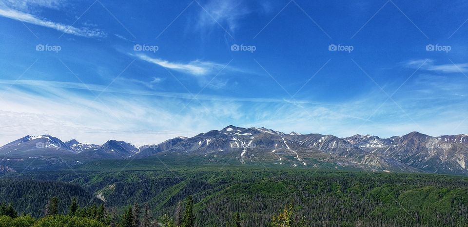 Big open skies over mountain ranges