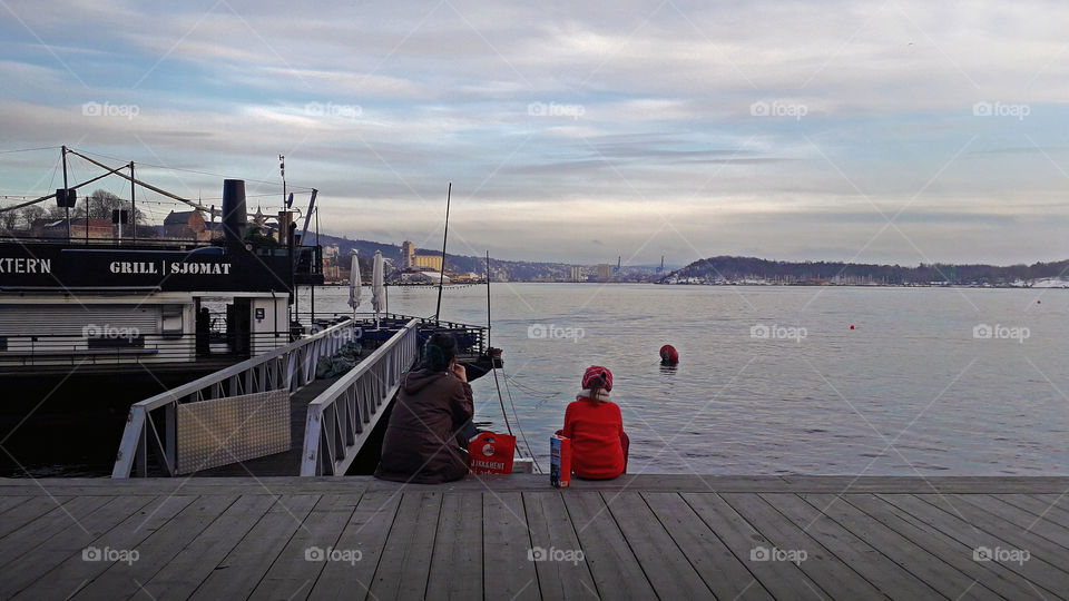 Pier of Oslo, child and woman enjoying their afternoon.