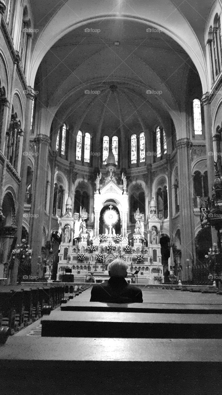 praying. old.man praying in old church