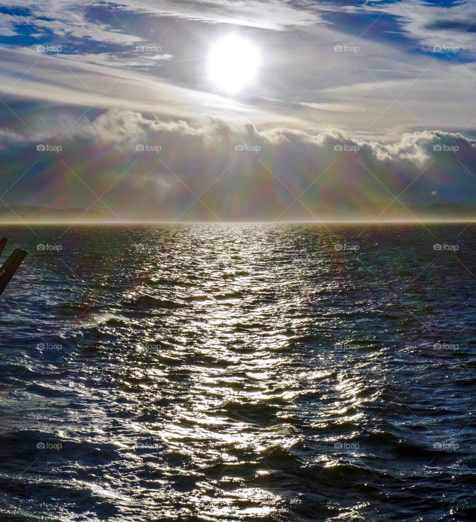 Dramatic sun shining on moving ocean 