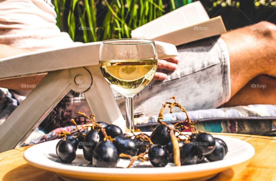 Wine grapes and a book