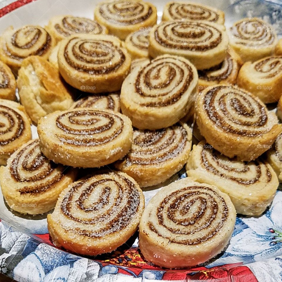 Pinwheel Cinnamon Cookies, hand made & baked from pie dough, cinnamon and sugar. Hand rolled pinwheel cookies, fresh baked. Pinwheel spiral homemade cinnamon cookies.