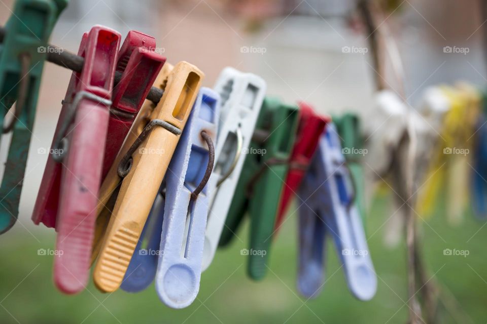 Old clothespins on a rope. Close up view , selective focus