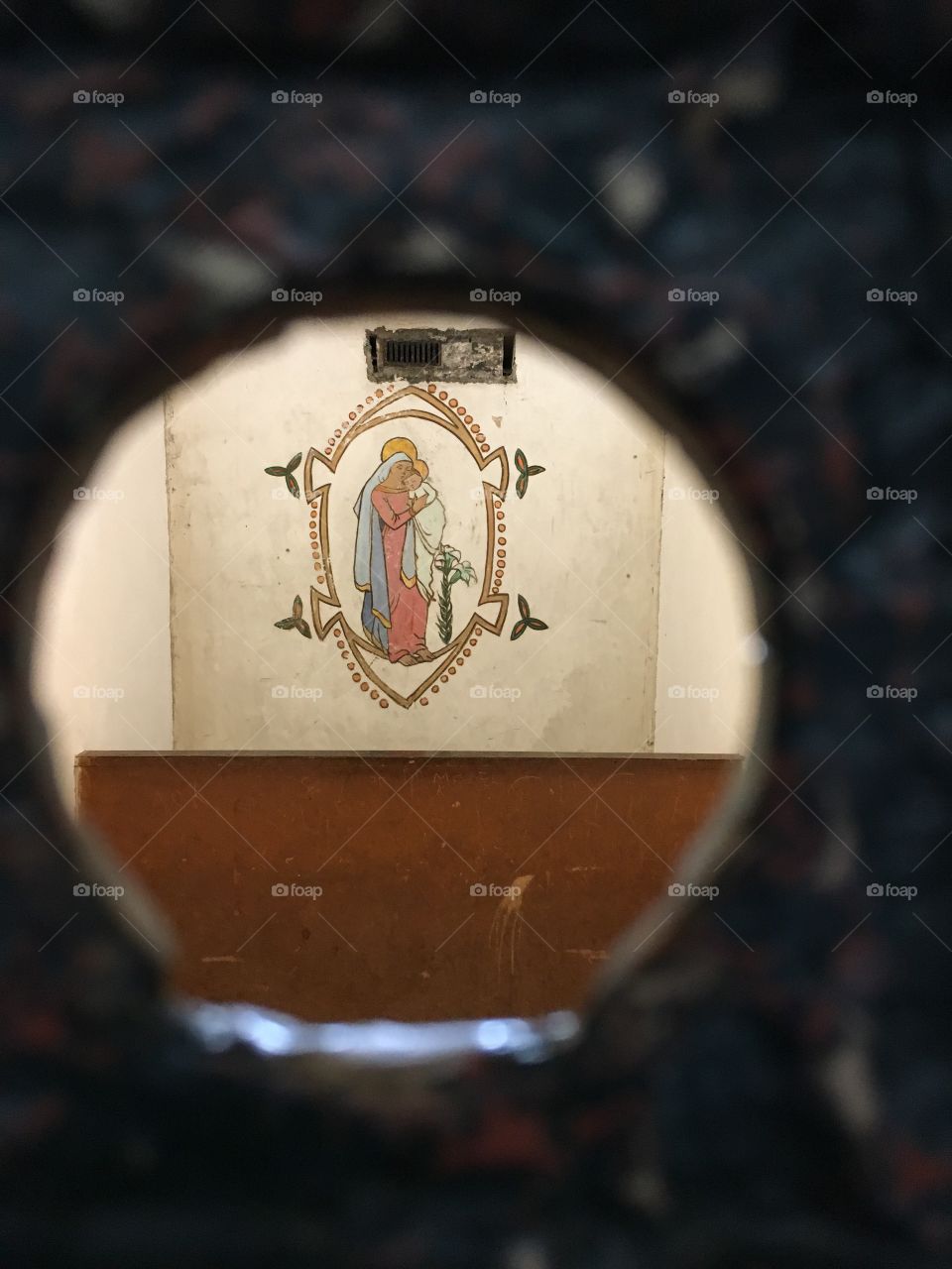 View into a cell in Kilmainham Gaol Dublin Ireland. Painting on the cell wall by prisoner. 