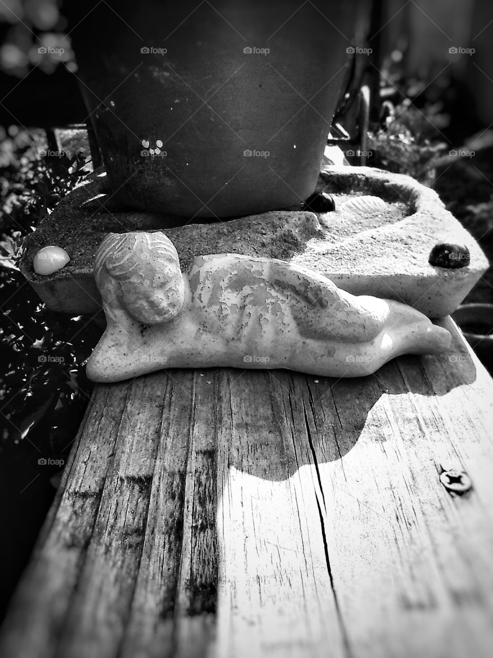 Small Statue In Shadows