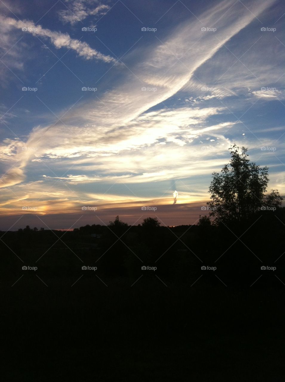 View from the Dog Park. Took this photo while at the dog park with my dog. Very pretty scene with the clouds, & sky. 