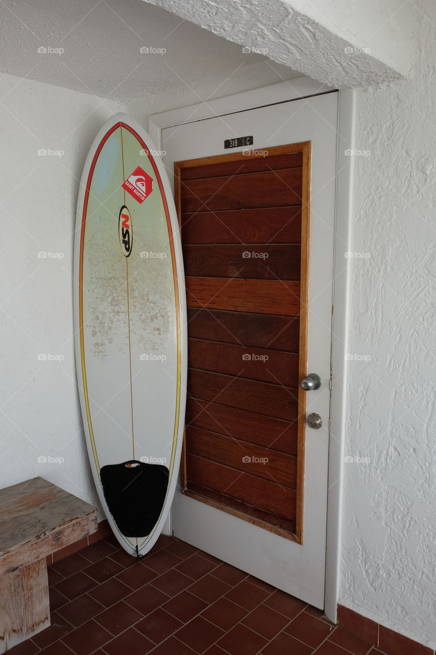 Favorite Spot At Home, Surfboard On Front Porch With Wooden Door