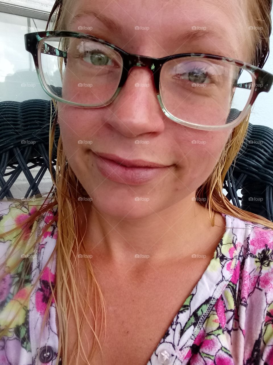 young woman wearing glasses with wet hair