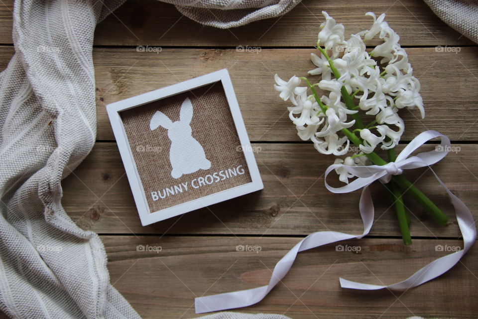 Easter bunny crossing sign flat lay with flowers