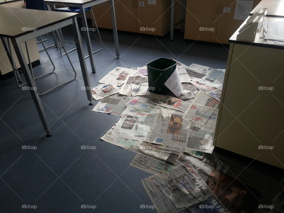 bin and newspaper for ceiling leak