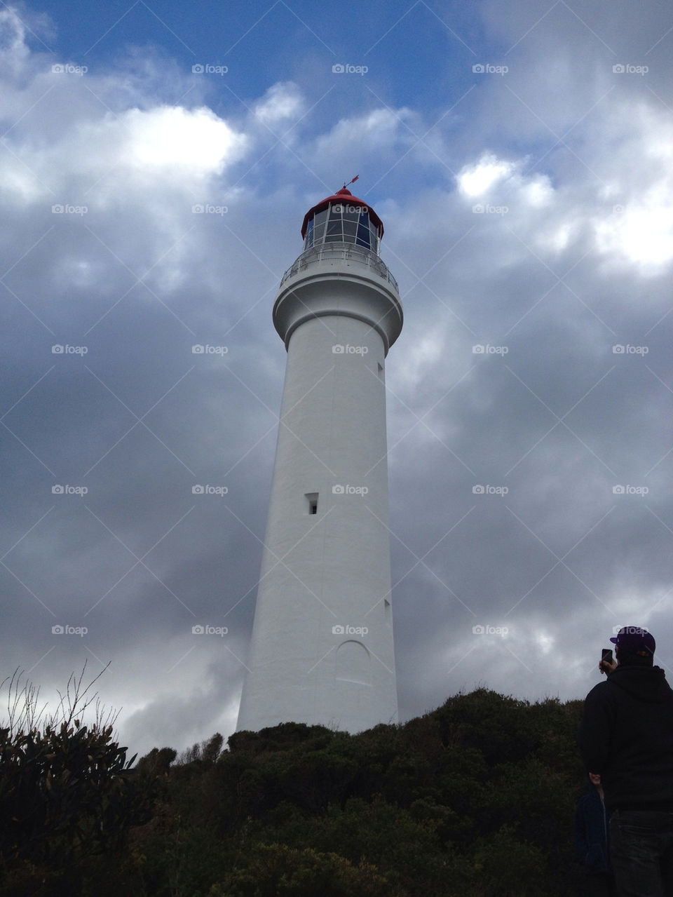 white clouds lighthouse overcast by splicanka