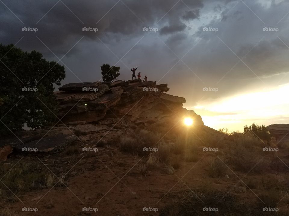 Sun & sky & Rocks & kids compete for attention in this Desert landscape