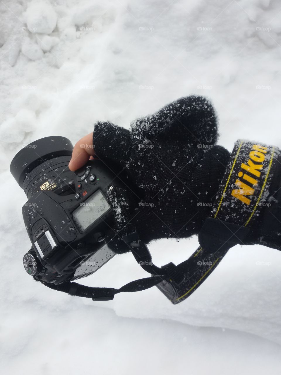 photographer with cam on snow