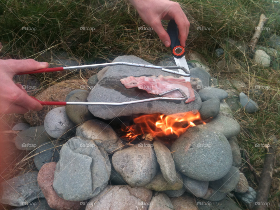 beach cooking fire bacon by caronglyn