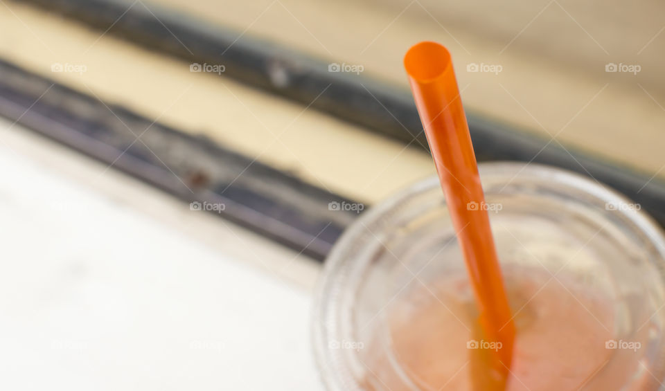 Plastic tea cup near window