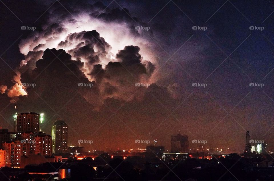 Lightning behind the clouds