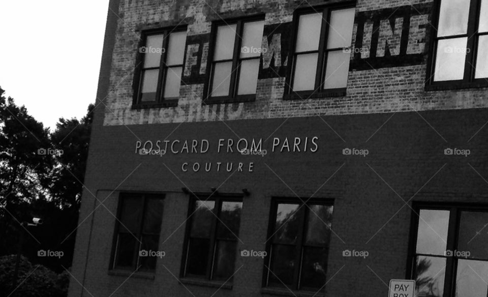 "Postcard from Paris" building logo