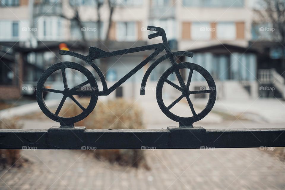 Metal decorative bicycle on parking