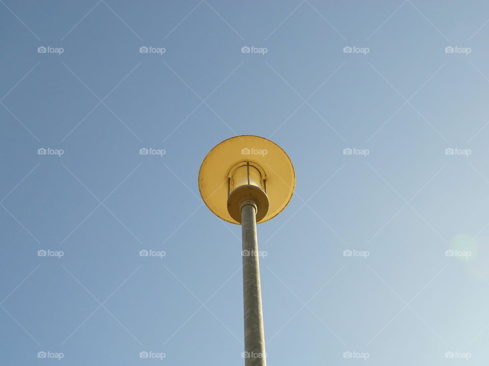 light for roadside and blue sky background