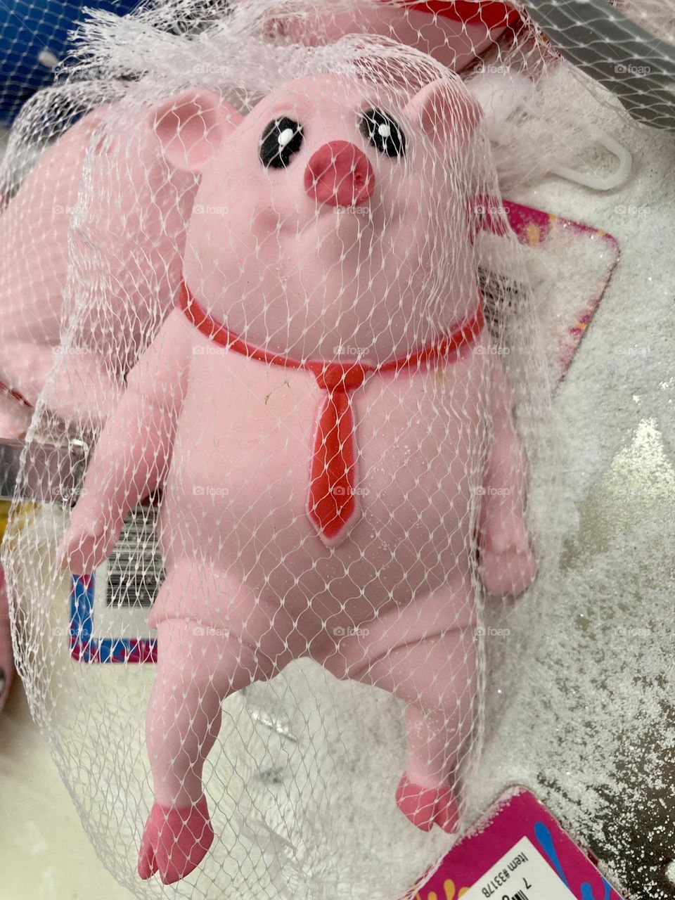 Strange pig toy in a tie