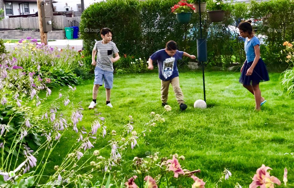 Kids having fun at the back yard on summer 