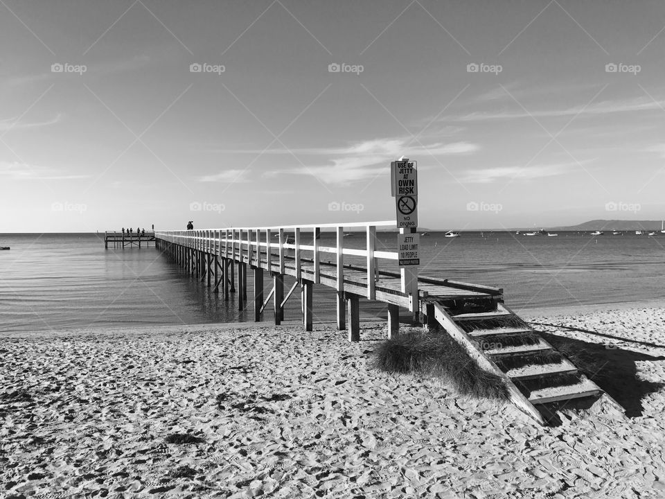 Sorrento Jetty in the afternoon sun black and white. Victoria Australia 