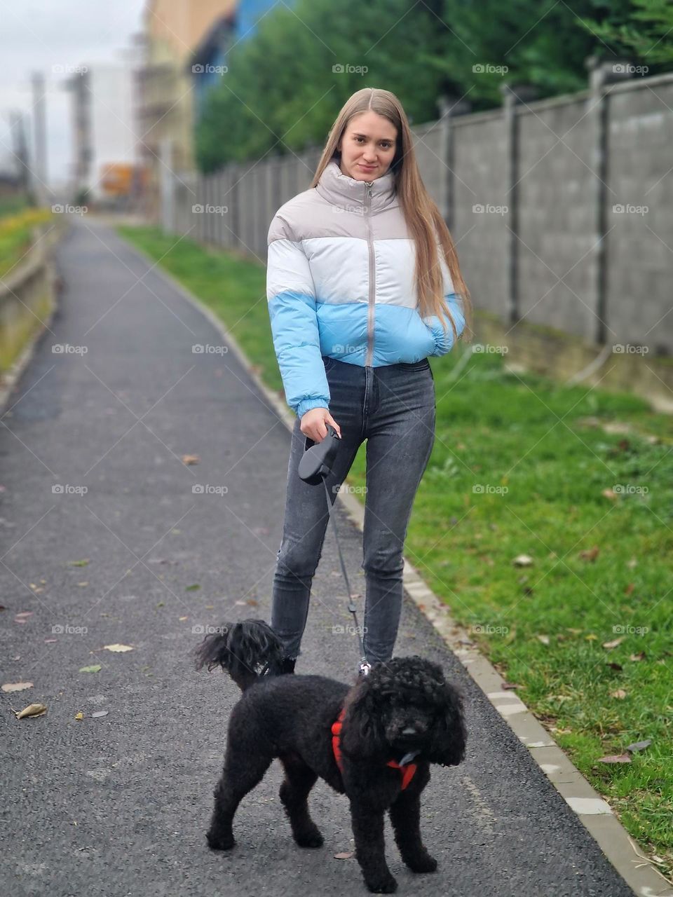 pretty girl walks her dog