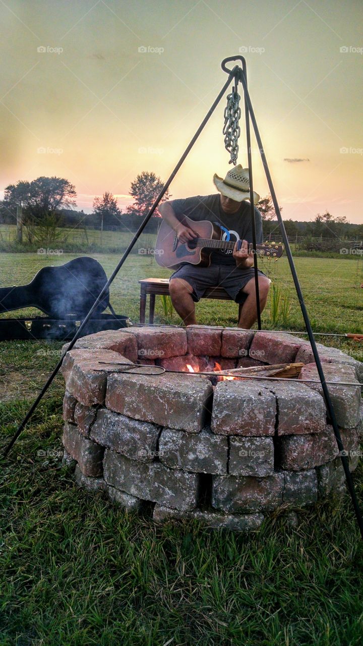 Fire Pit and Guitar Player at Sunset