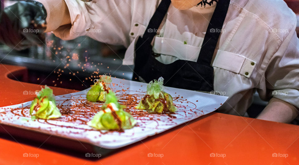 Chef cooking dumplings at a high cuisine restaurant