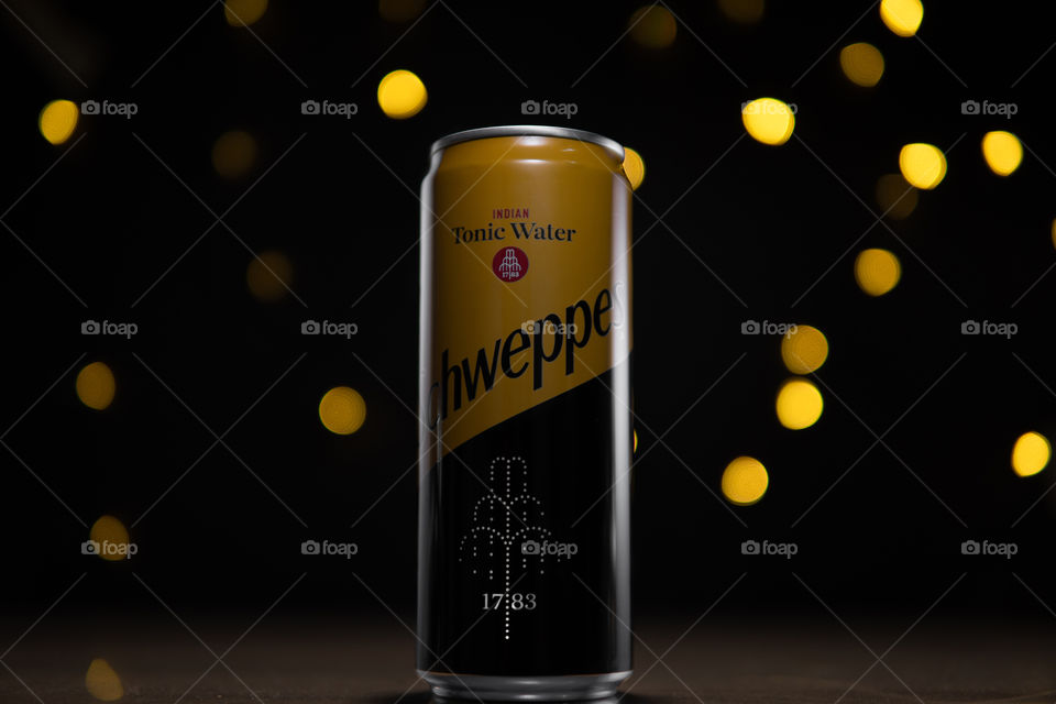 Schweppes can on black background