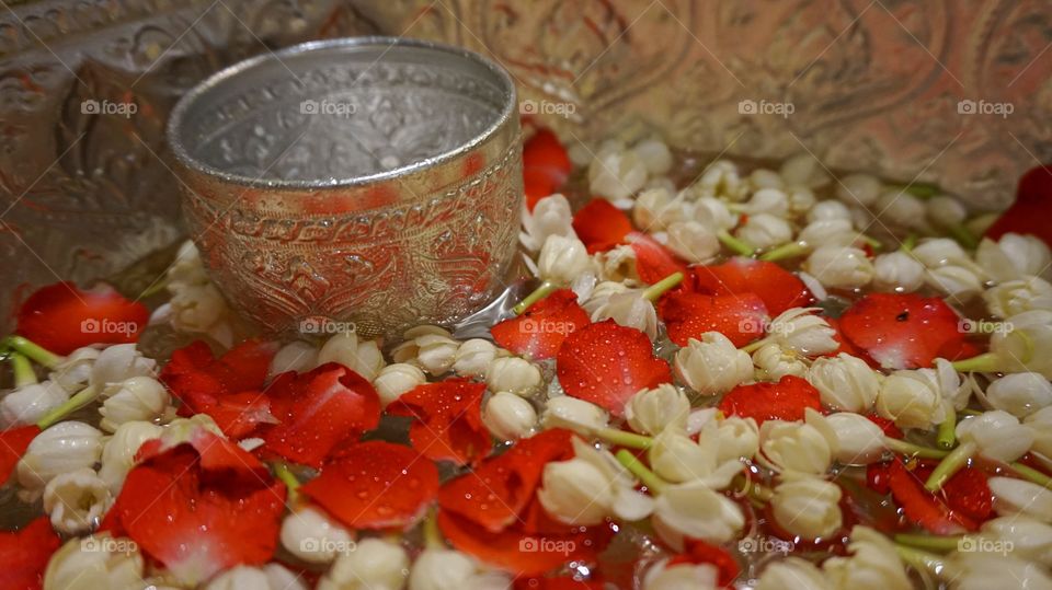 Jasmine and rose floating on water