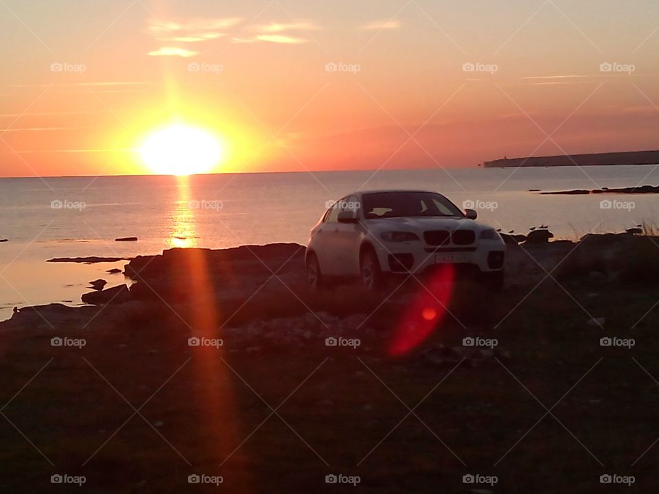 sea sunset and car