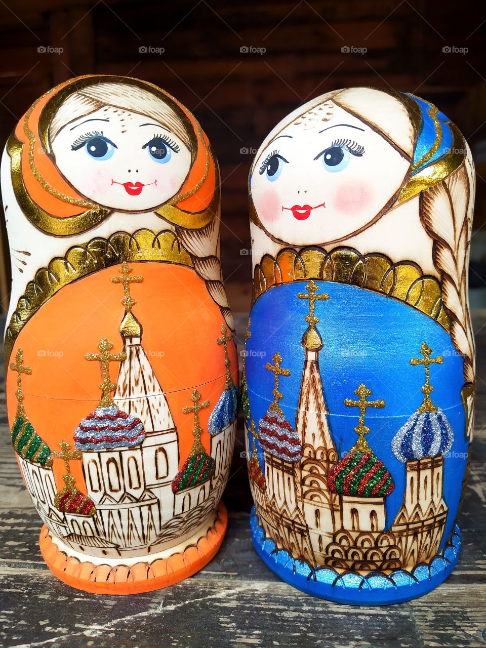 Russian nesting dolls in orange and blue colors