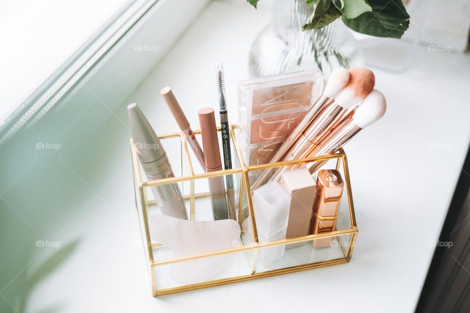 Makeup products on window sill