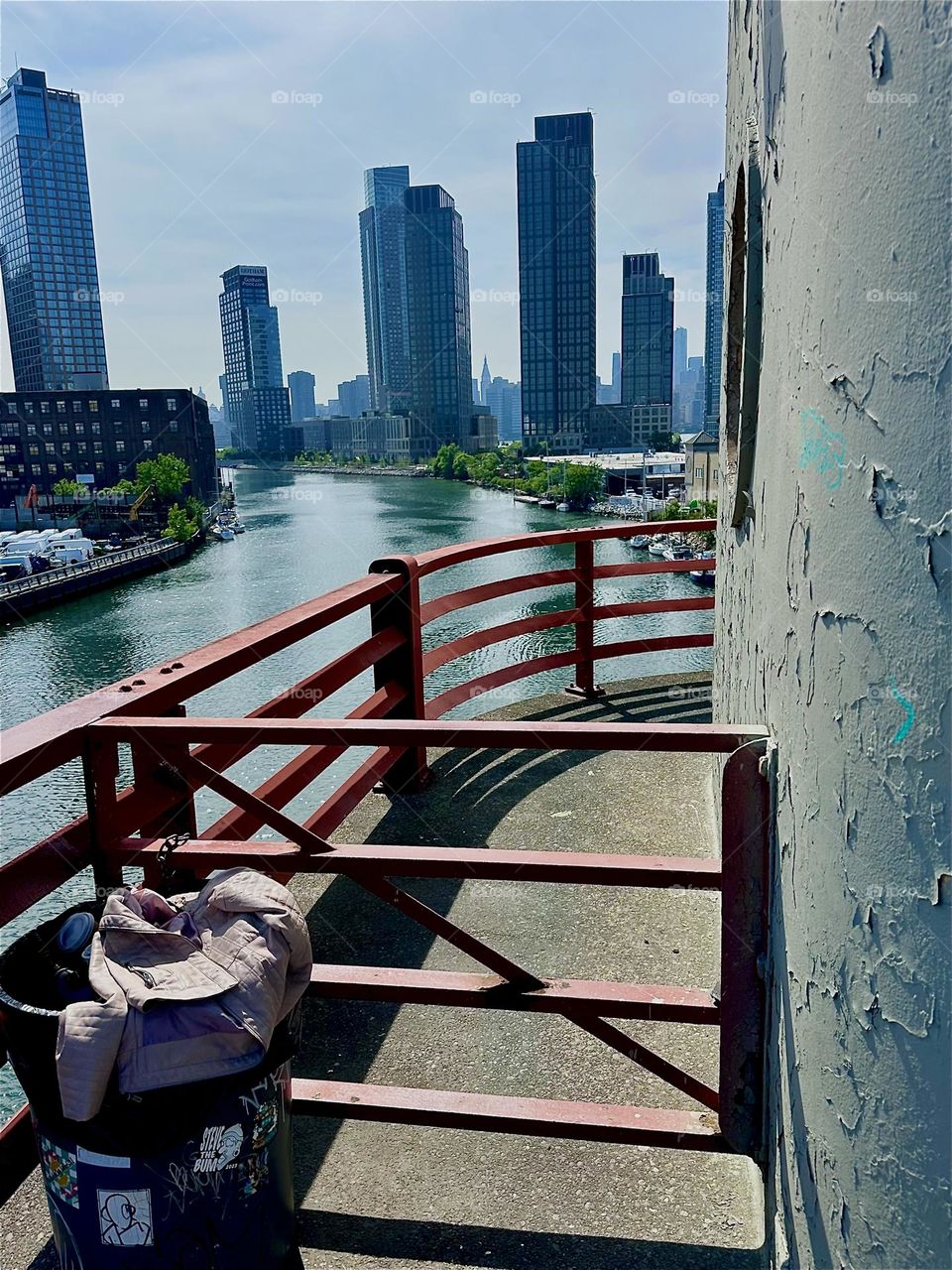 This is beautiful “Newtown Creek” seen from the central outpost of the “Pulaski Bridge” that connects “Greenpoint”, Bklyn to LIC, Queens. Across the water of the “East River” we see “Manhattan” in the distance. 2024. Hypnotic Productions
