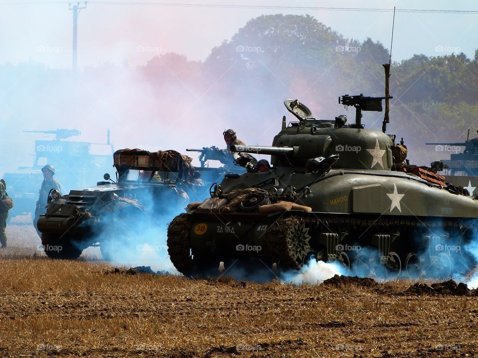 Tanks shrouded in smoke during battle 