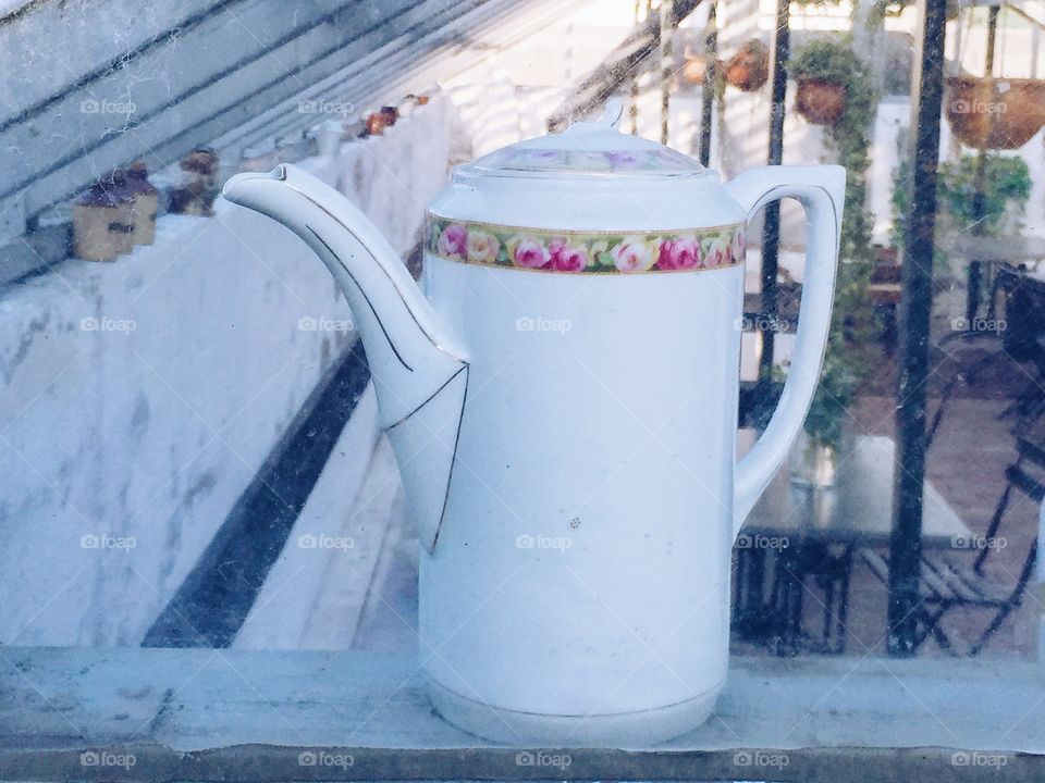 Porcelain pourer in a window