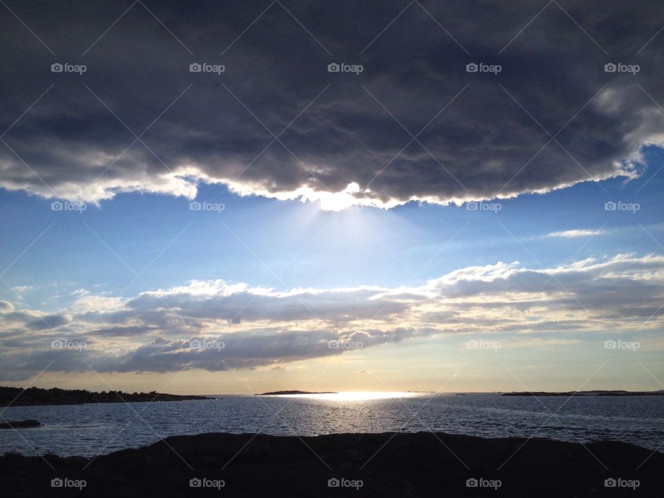 Scenic view of sea against cloudy sky