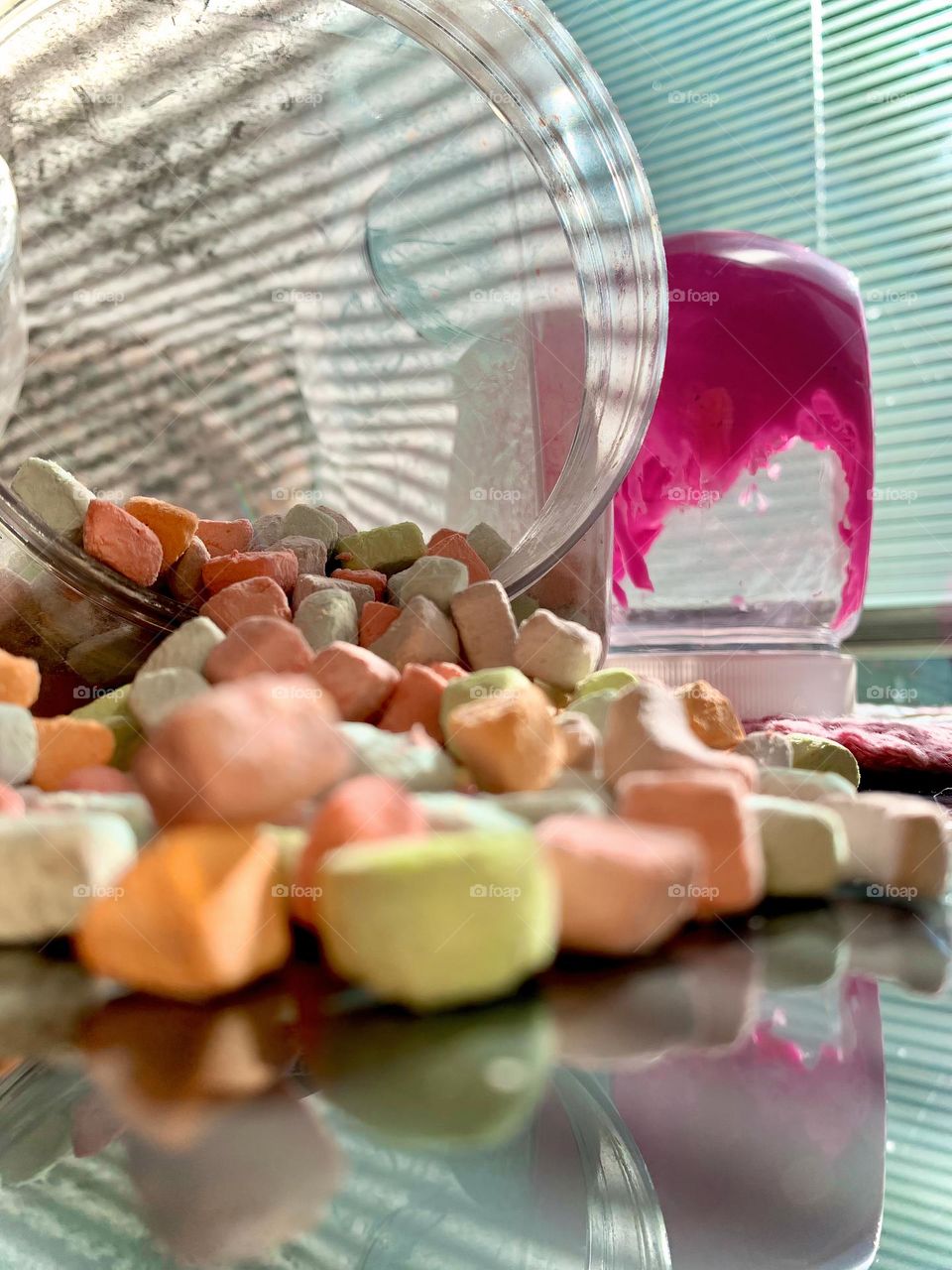 Colorful Pastel Mini Marshmallows Falling Off Clear Plastic Jar By Pink Slime Container.